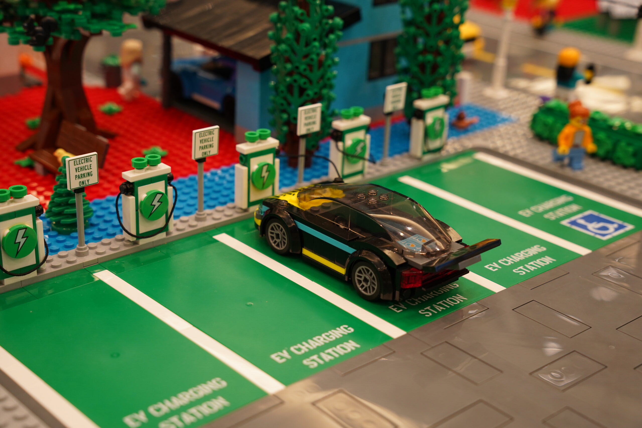 Close-up of LEGO electric vehicle charging stations in the Huber Advanced Materials city display