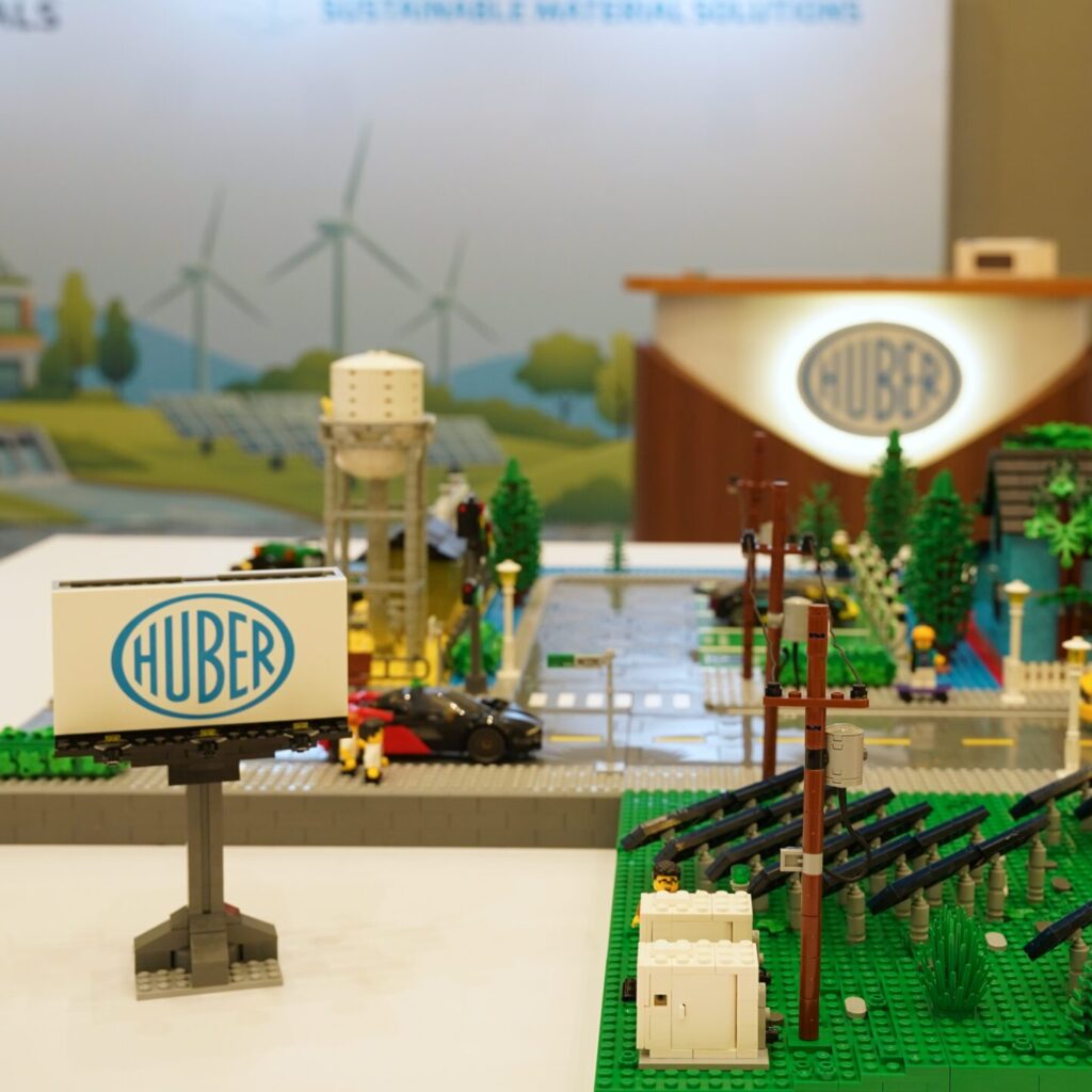 Photo of Huber Advanced Materials' 3-foot-9-inch square modular LEGO® brick city at the center of HUBERpalooza at the Ritz-Carlton Amelia Island in June 2026, created by Brick Built Models.